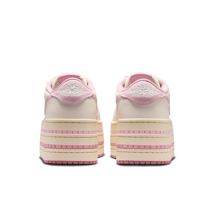 Back view of pale ivory sneakers with pink heel tab and stacked stripe platform