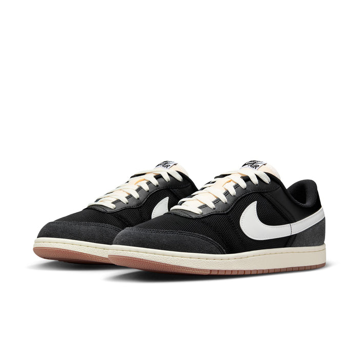 Pair of men's black low-top sneakers with white Swoosh and lace-up, gum outsole