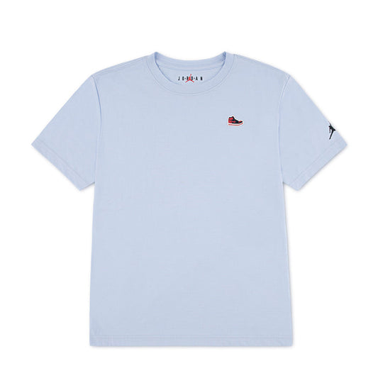 Youth light blue T-shirt with small Jordan sneaker patch on left chest