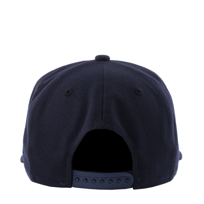 Navy baseball cap back view with adjustable eyelets on strap