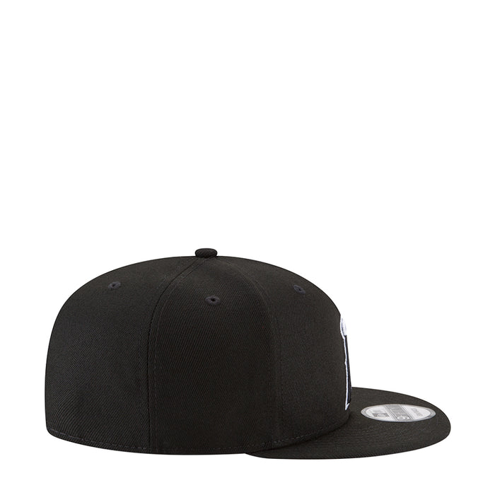 Black baseball cap with white side logo and curved brim