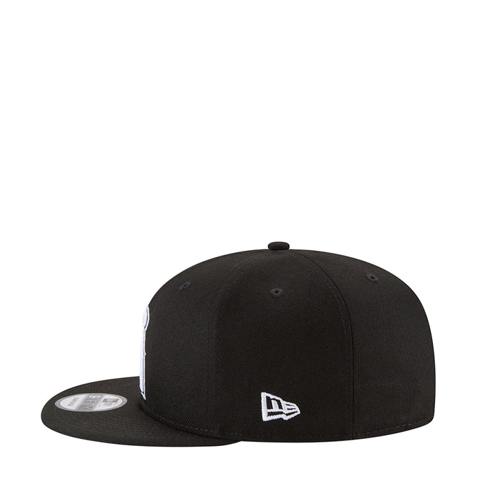 Black baseball cap with white small logo on front panel