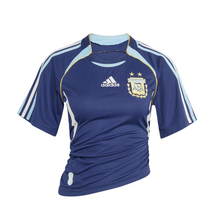 Women's dark blue soccer jersey with light blue shoulder stripes and yellow trim