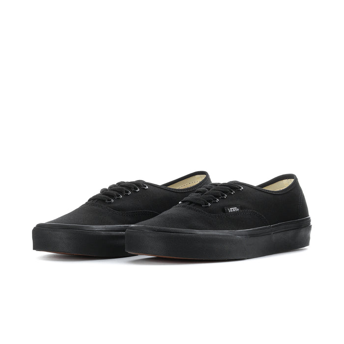 Men's black low-top sneakers, lace-up with tan interior lining