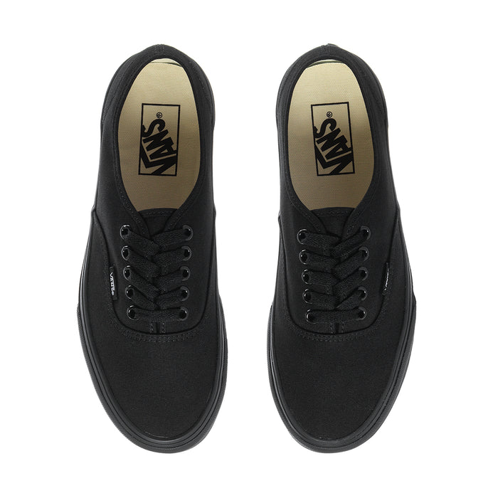 Pair of men's black low-top sneakers showing padded tongue and lace eyelets