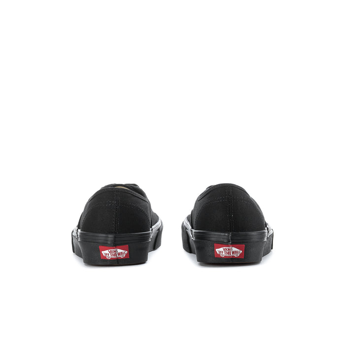 Men's black low-top sneakers, rear view with heel label detail