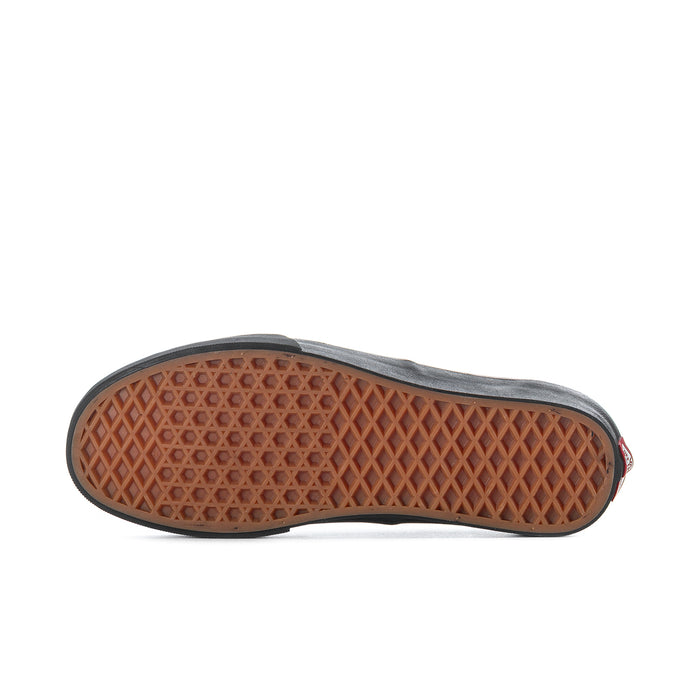 Men's black low-top sneakers with brown rubber outsole tread underside