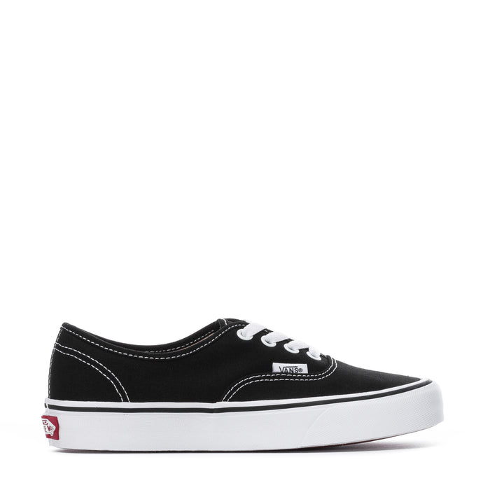 Black low-top canvas sneaker with white lace-up and Vans logo patch