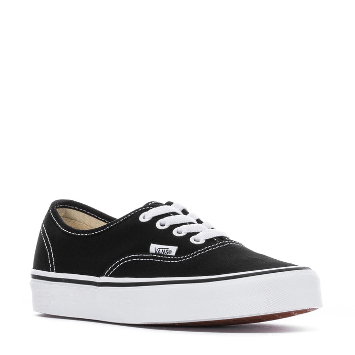 Black low-top canvas sneaker with white laces and Vans tongue label