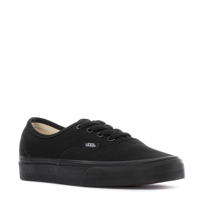 Black youth low-top sneakers with lace-up front and Vans logo, interior lining visible