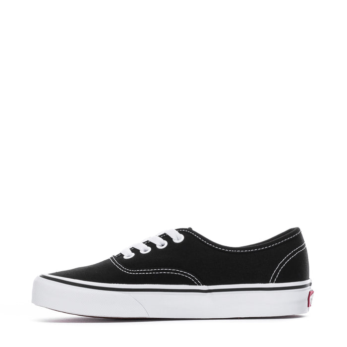 Black/white low-top canvas sneaker with white laces and side stitching
