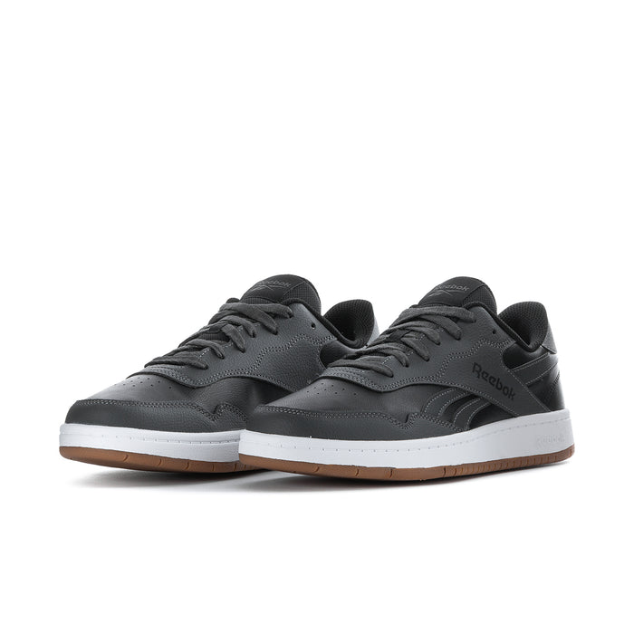 Men's Reebok low-top sneakers lace-up in black/grey with gum outsole and white sole