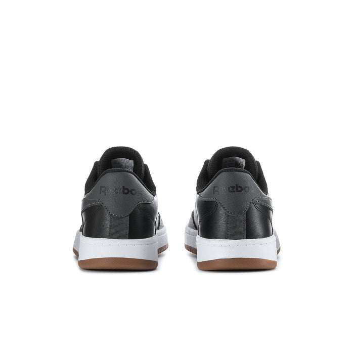 Men's Reebok low-top sneakers rear view, black heel tab and white stripe