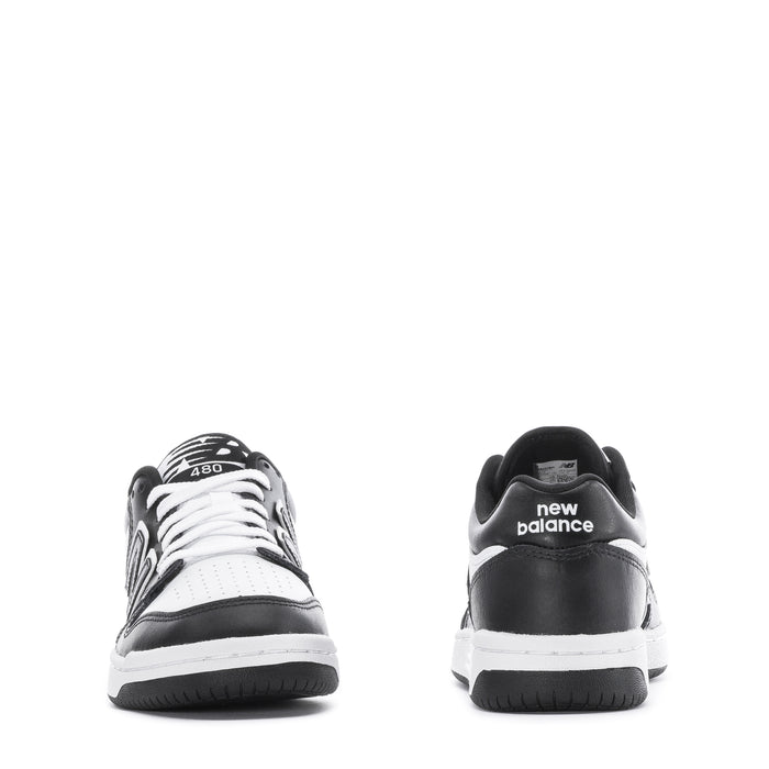 Youth New Balance sneakers, heel view with new balance text and black outsole