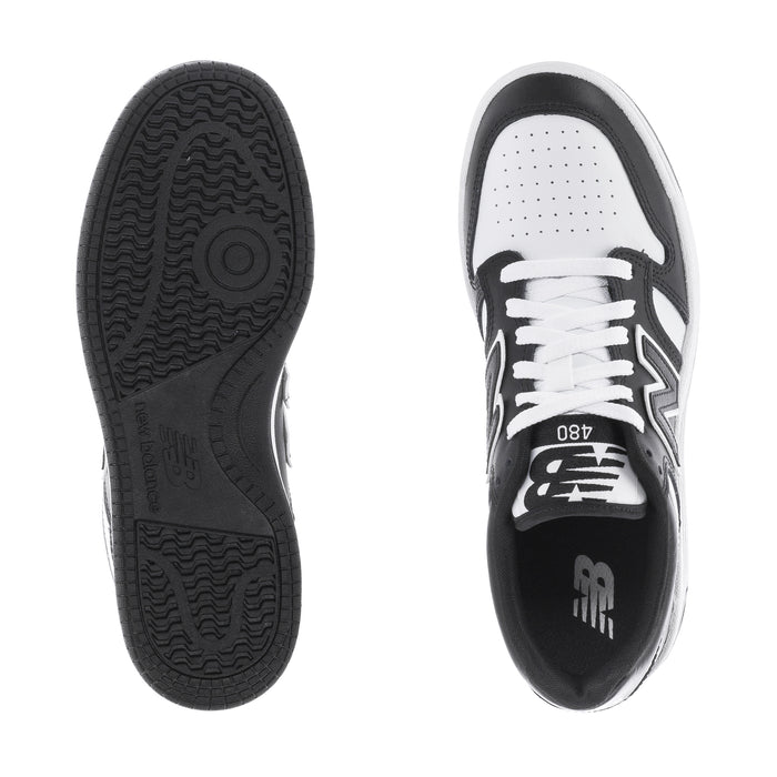 Youth New Balance sneakers, black rubber outsole and white perforated inner