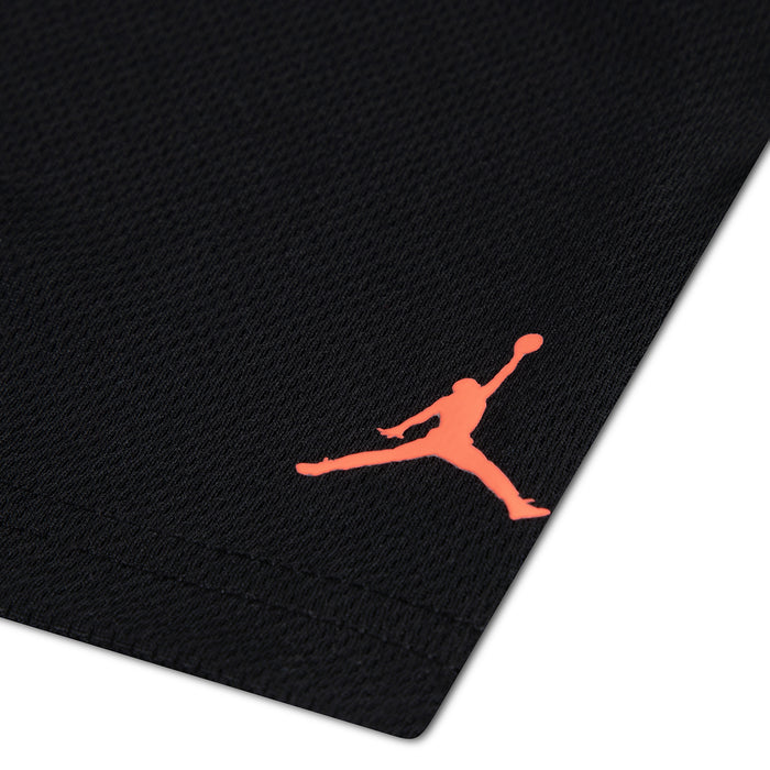 Kids black shorts with small orange Jordan Jumpman logo on leg