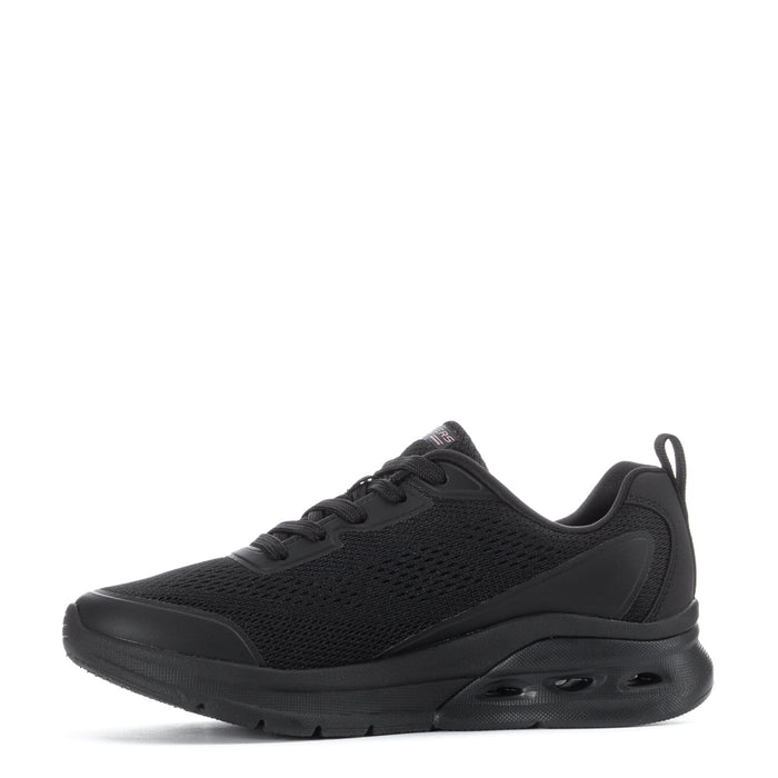 Women's black low-top lace-up sneakers, side view with padded collar