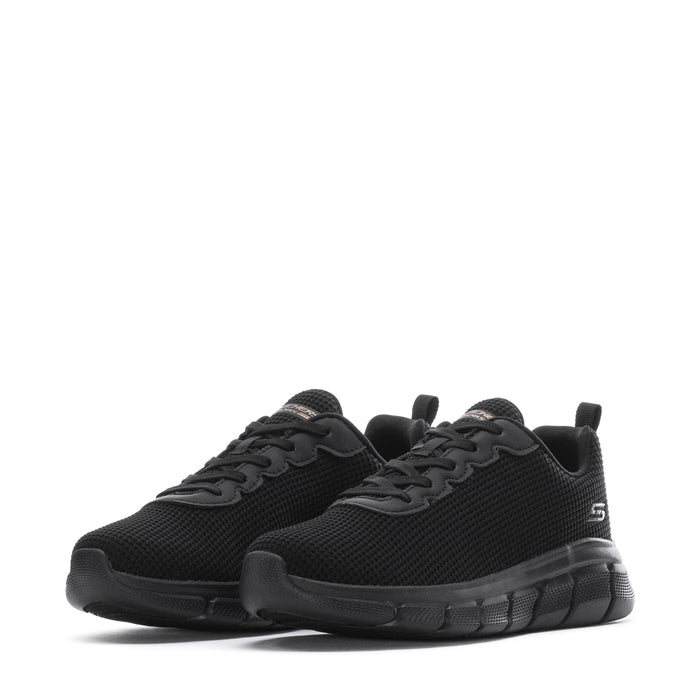 Pair of women's black lace-up sneakers with rounded toe and rubber tread sole