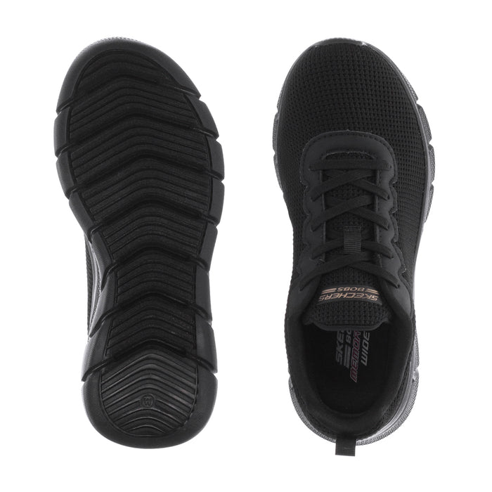 Women's black sneaker outsole and heel view with deep traction tread