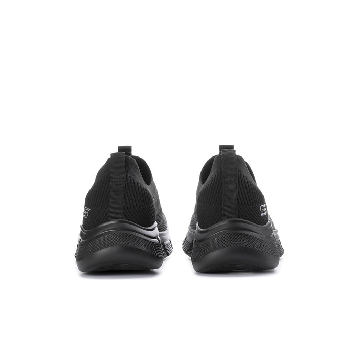 Men's black slip-on shoes, rear view, padded heel and outsole tread