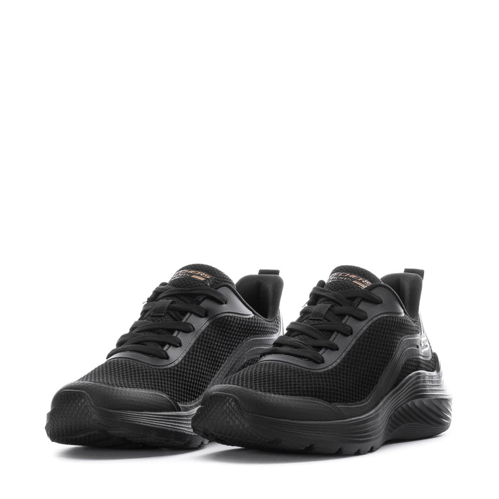 Black pair of lace-up athletic sneakers with textured uppers and chunky low sole
