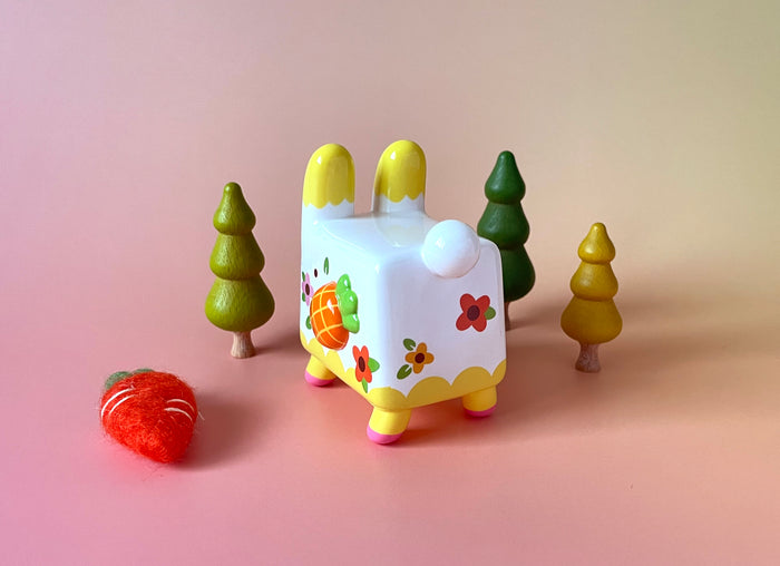 Box Rabbit by Rato Kim: A 4-inch soft vinyl toy featuring a rabbit with floral and fruit designs. Limited edition of 100 pieces.