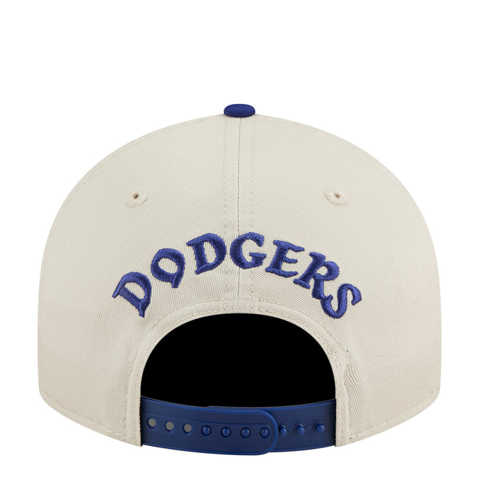 Cream baseball cap with blue DODGERS lettering on the back