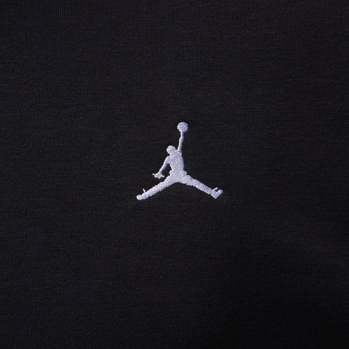 Black fleece hoodie fabric with small white Jumpman logo
