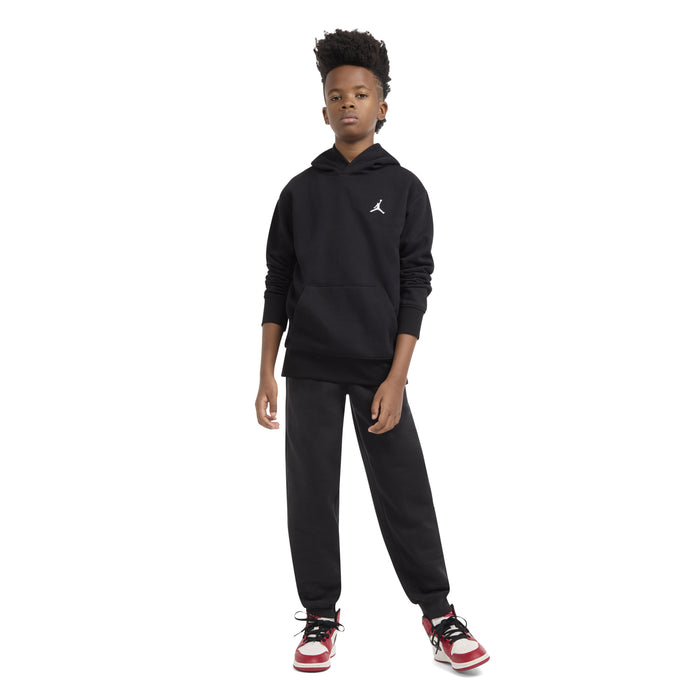 Youth black fleece pullover hoodie with hood and Jumpman logo, front three-quarter view.