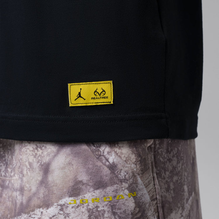 Black tee hem with yellow RealTree Air label patch