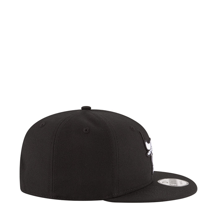 Black baseball cap side profile with curved brim and stitched panels