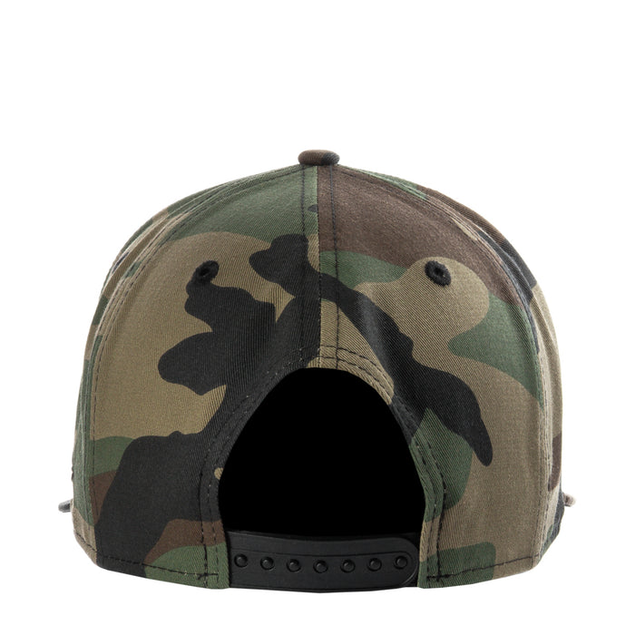 Camo baseball cap viewed from back, showing ventilation eyelets and snapback strap