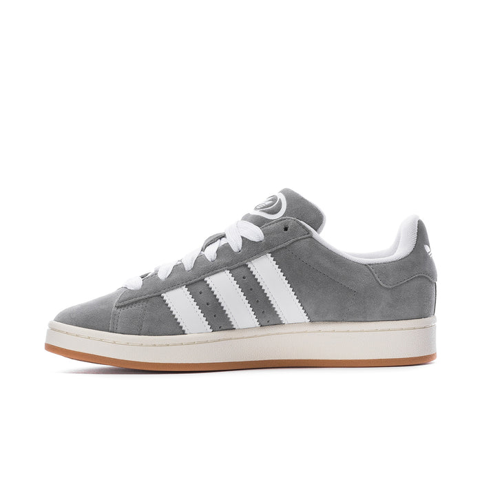 Men's grey low-top sneakers with white three-stripe design and gum-brown sole