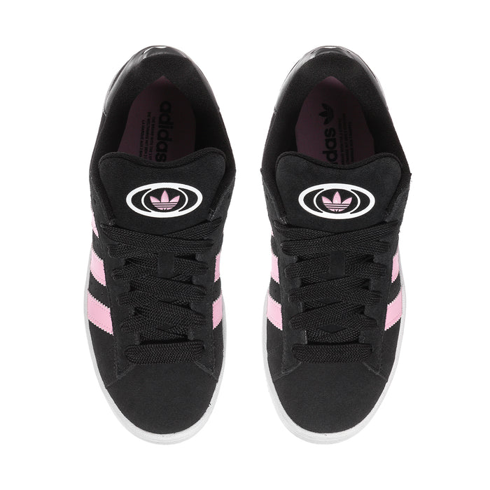 Pair of black lace-up sneakers with pink stripe accents and white rubber sole.