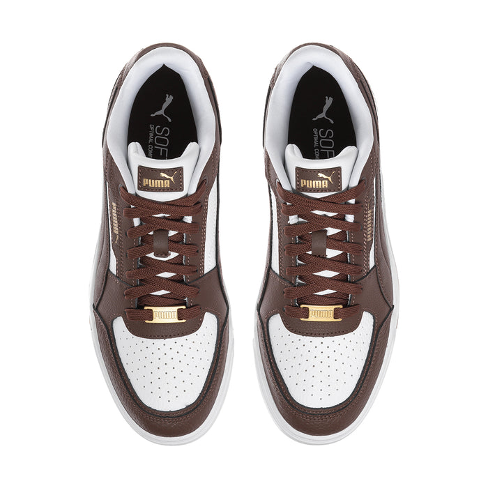 Brown and white lace-up sneakers viewed from front with Puma logo on tongue