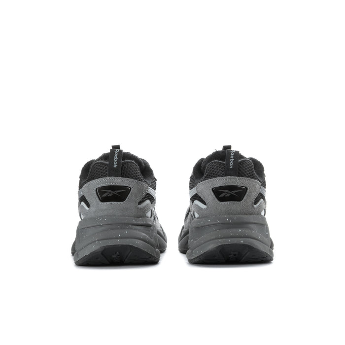 Men's grey and black running sneakers, rear view with heel tabs