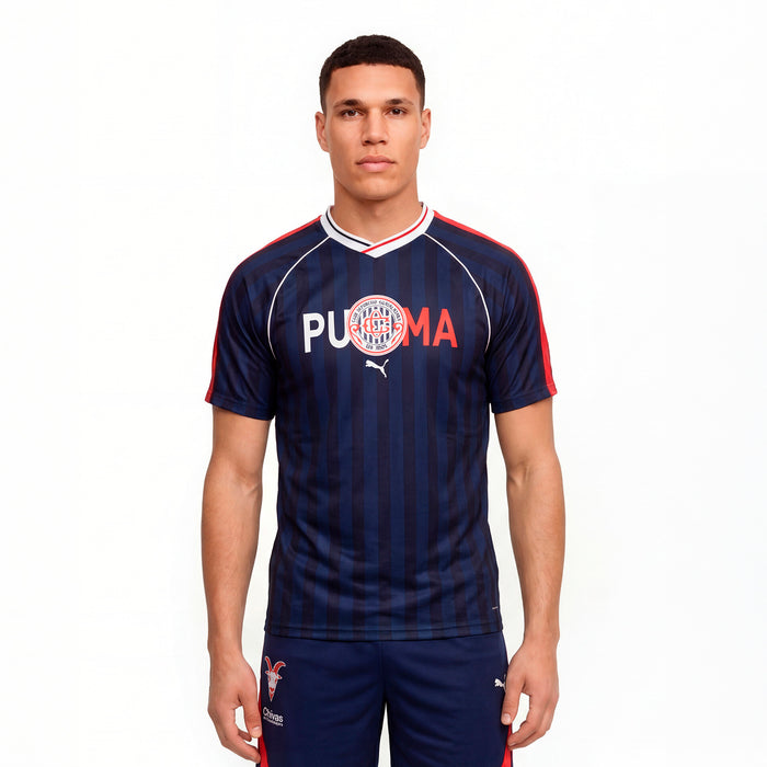 Men's navy soccer jersey on model, V-neck with red and white collar trim