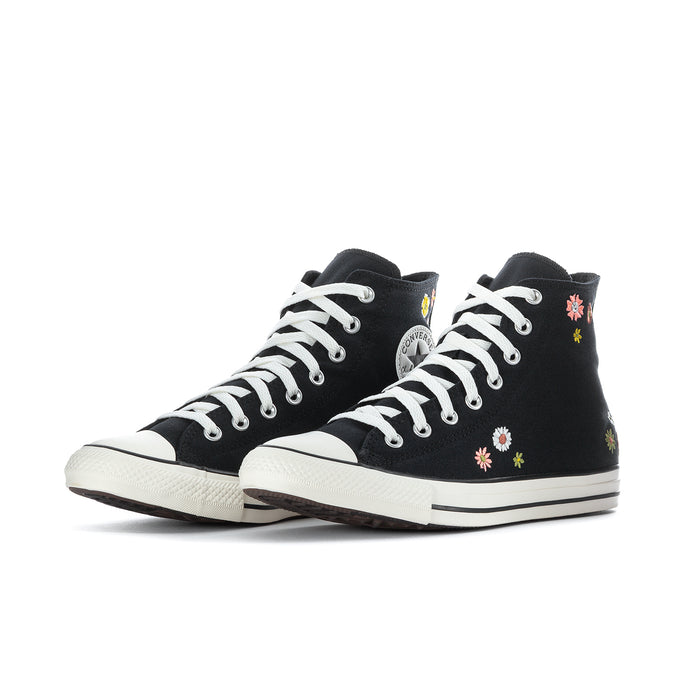 Black high-top Converse sneaker with floral embroidery and white lace-up, side view