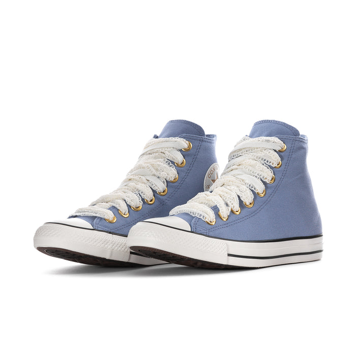 Pair of women’s blue canvas high-top sneakers with white lace trim and gold eyelets