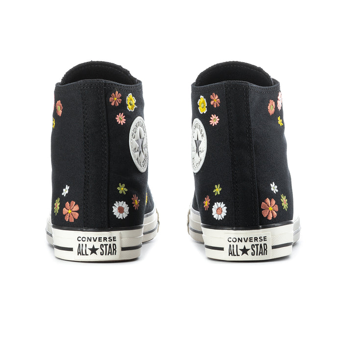 Black high-top sneaker backs with floral embroidery and Converse All Star heel patch