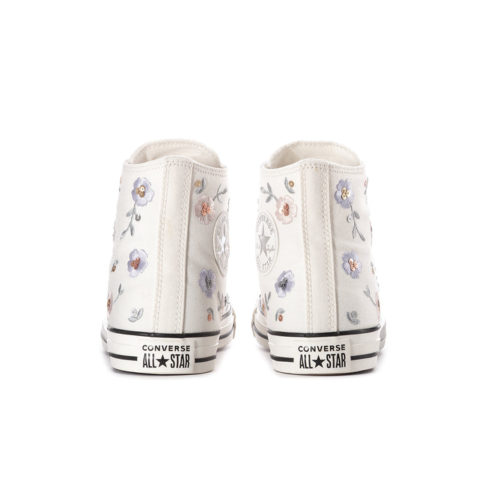 Women's white high-top sneakers from the back with floral heel embroidery and Converse All Star label