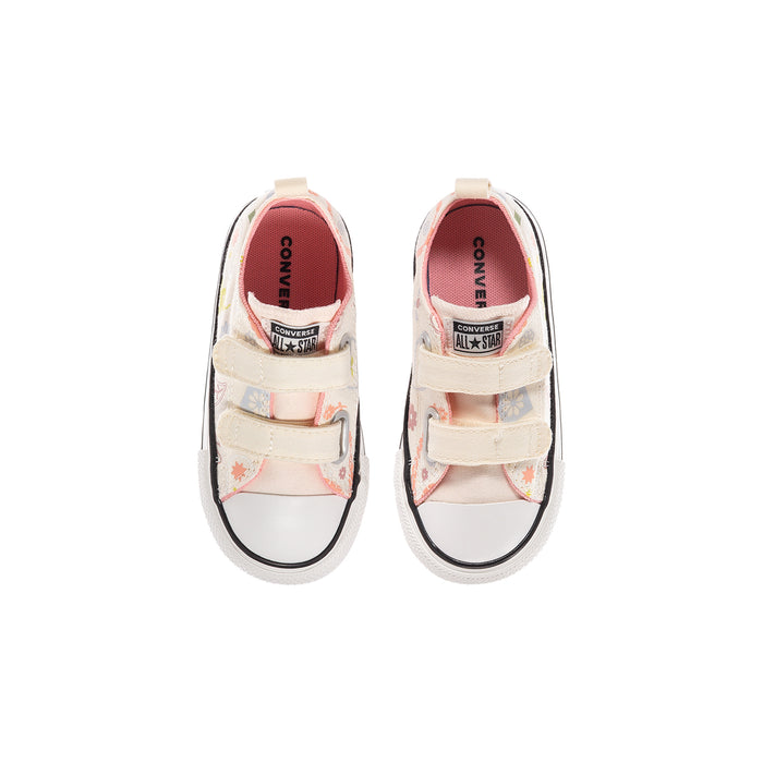 Kids' low-top sneakers, open tongue view; coral lining and Converse All Star label