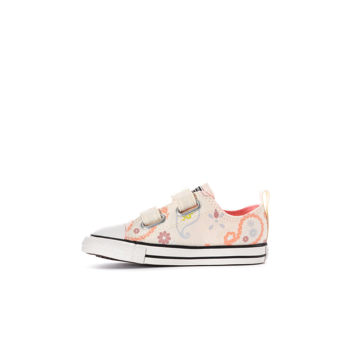 Kids' low-top canvas sneakers, front view; white with multicolor paisley and velcro strap