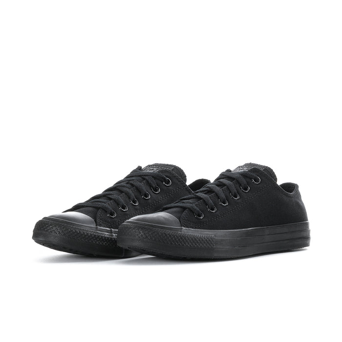 Pair of black low-top lace-up canvas sneakers with rubber toe caps and textured sole