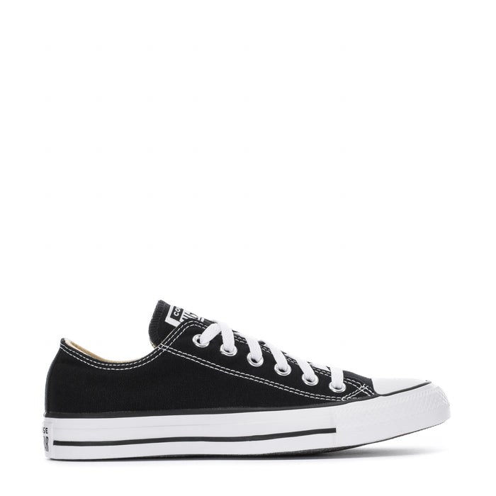 Youth black canvas low-top sneakers with white laces and rubber toe cap