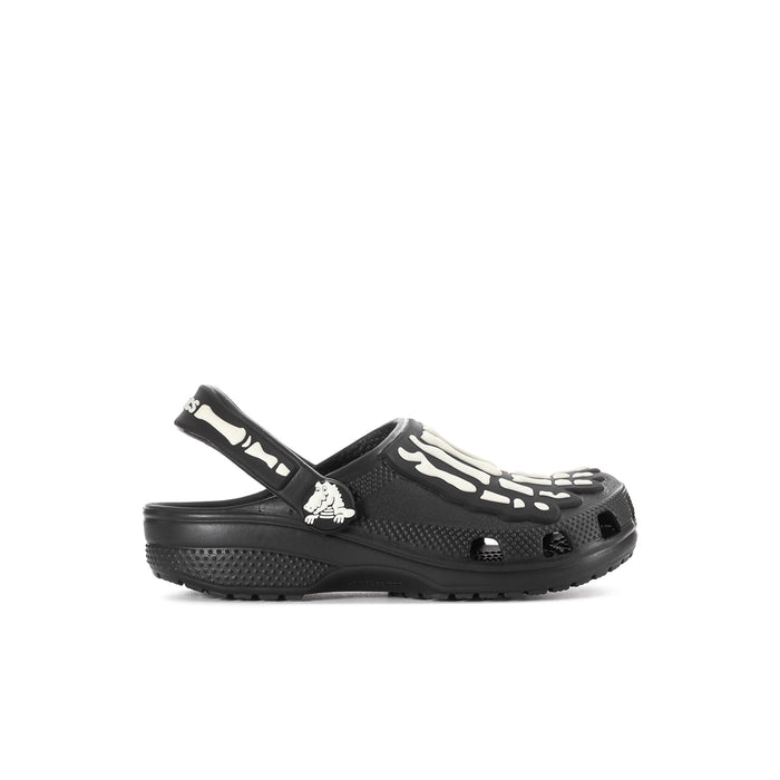 Kids' black clog with white skeleton graphic on top strap, vented upper and tread sole