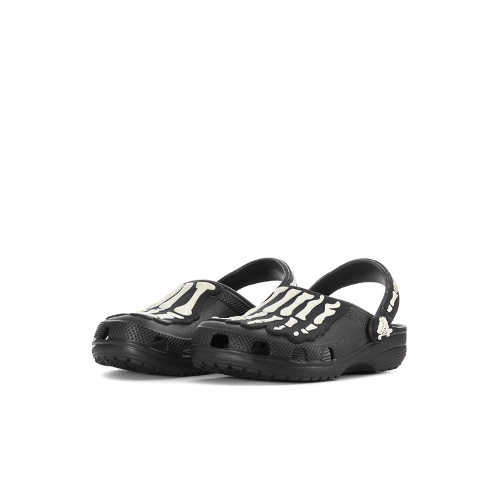 Kids' black clog pair angled side view with white skeleton graphics on uppers