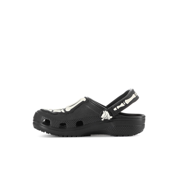Kids' black clog with white skeleton graphic on strap, single shoe side view
