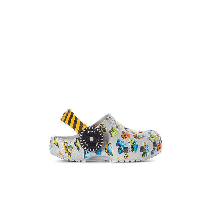 Toddler clog with white car print, orange/yellow striped strap, and dark circular top