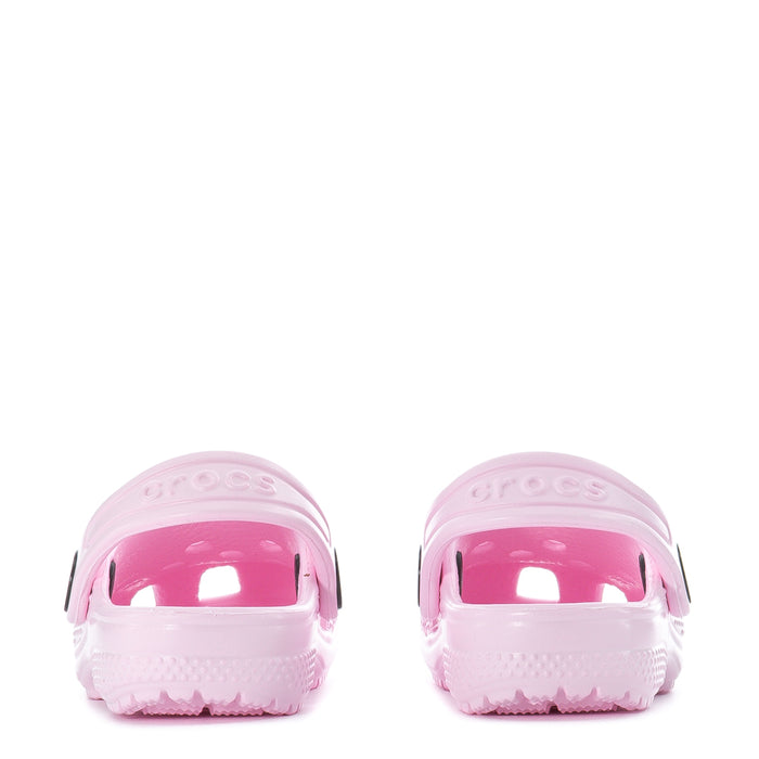 Pink toddler clogs, front view with strap openings and molded ventilation texture